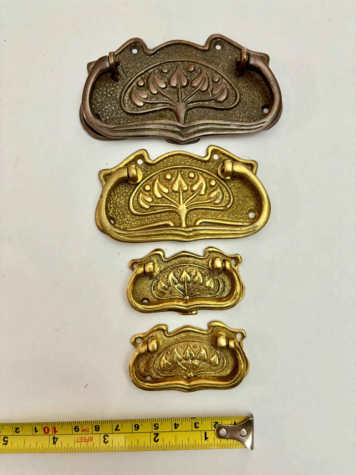 Four Large Mixed Antique Brass Drawer Pull Handles