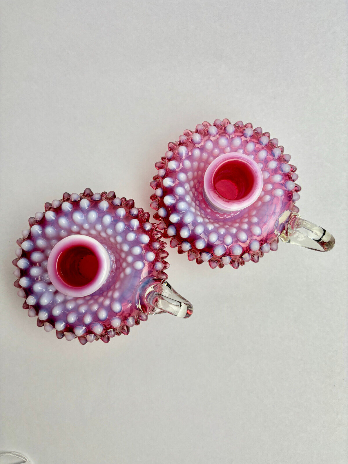 Pair of Fenton Cranberry Opalescent Hobnail Candlestick Holders (9cm tall)