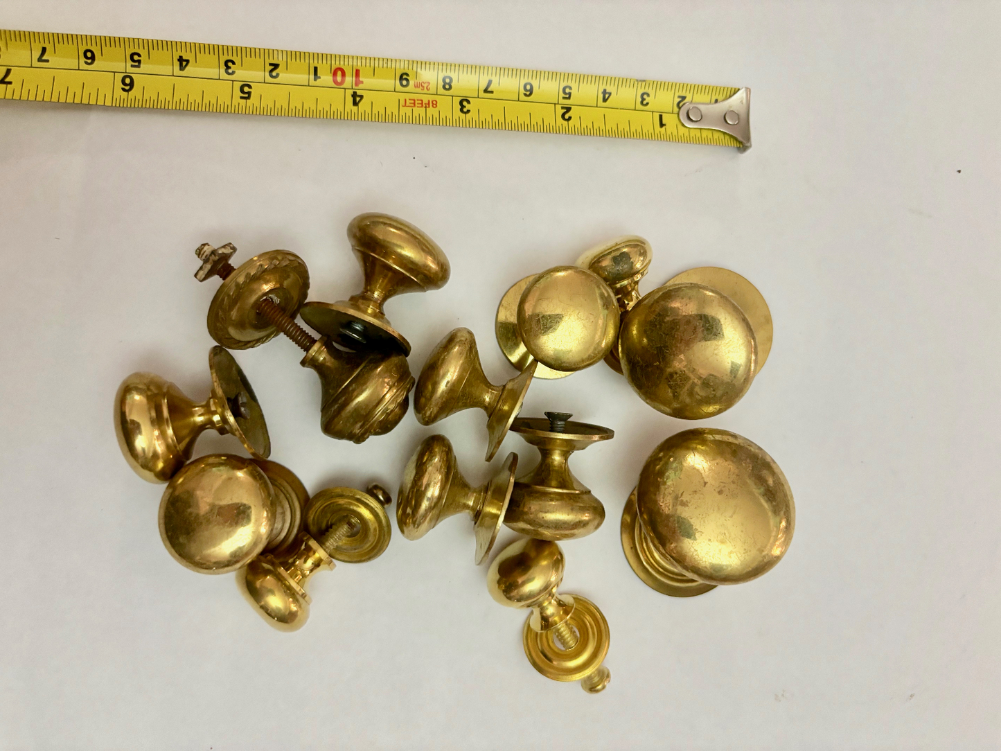 Twelve Mixed Antique Brass Drawer Pull Handles