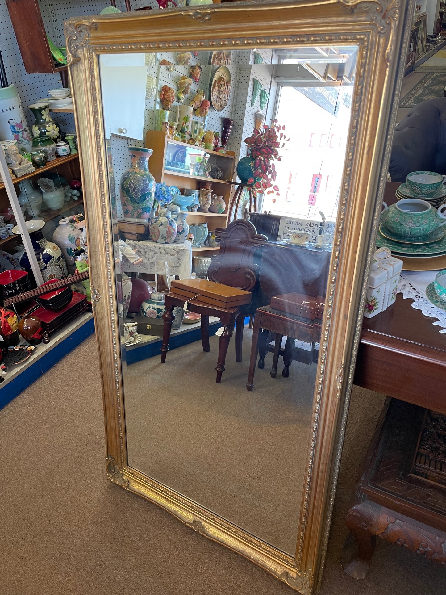 Large vintage ornate gilt framed mirror with beveled edge