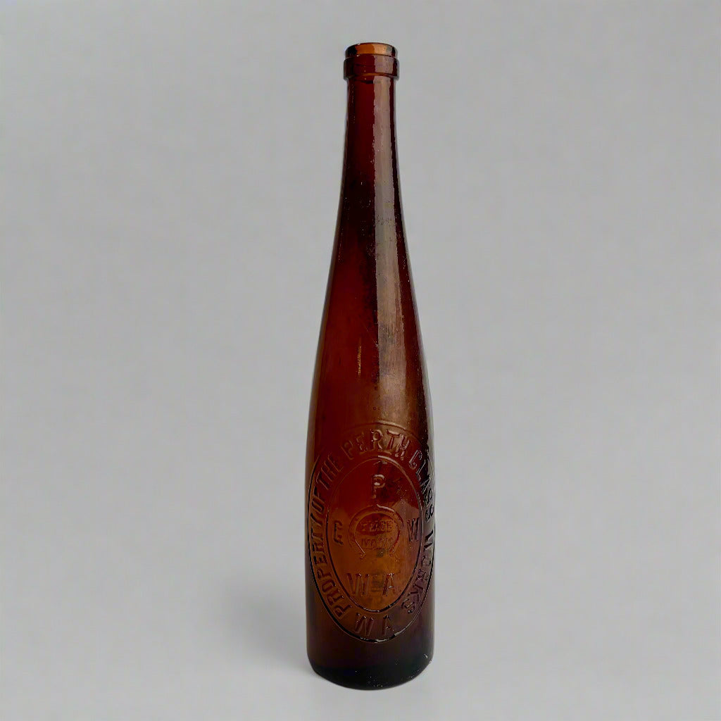 Brown bottle with embossed label on a white background