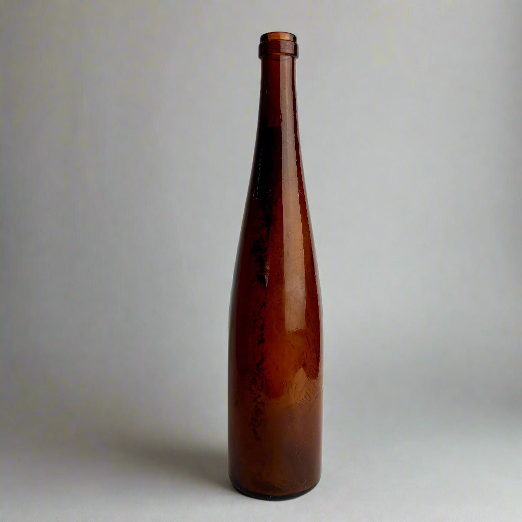 Brown glass bottle on a white background