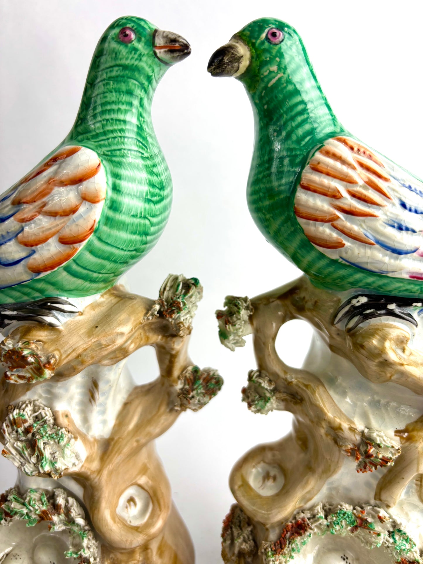 Pair of Antique Staffordshire pottery figurines of exotic pigeons with nests