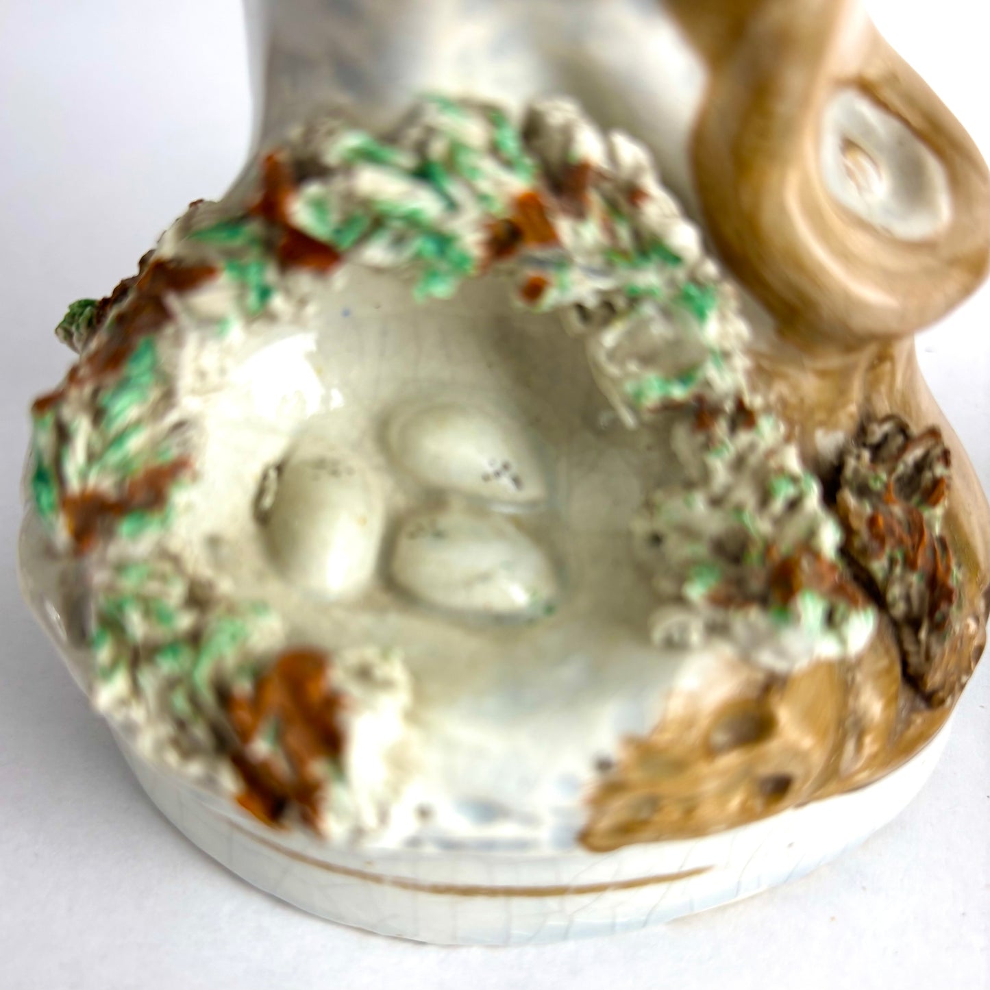 Pair of Antique Staffordshire pottery figurines of exotic pigeons with nests