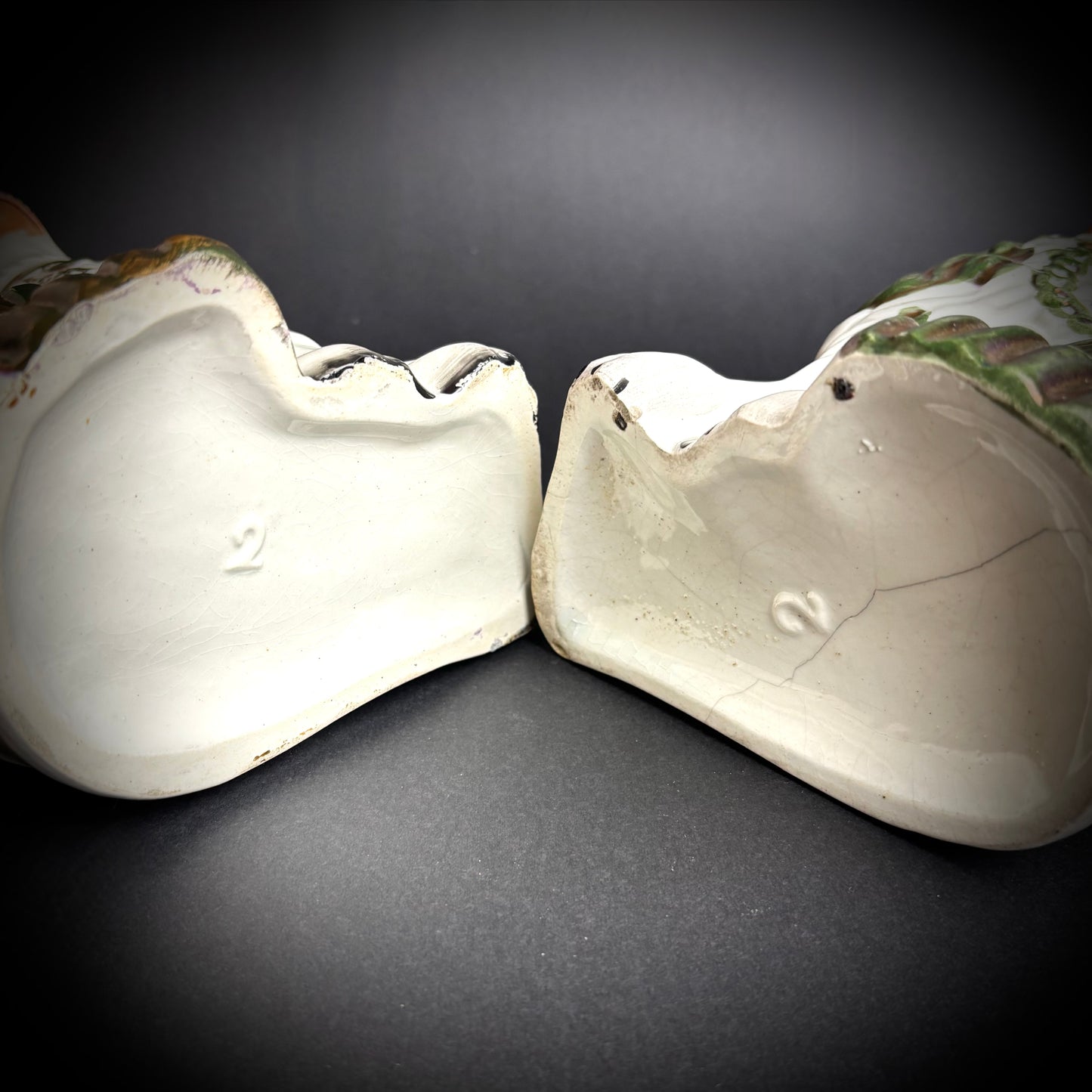 Pair of antique Staffordshire Green Lustre Spaniels