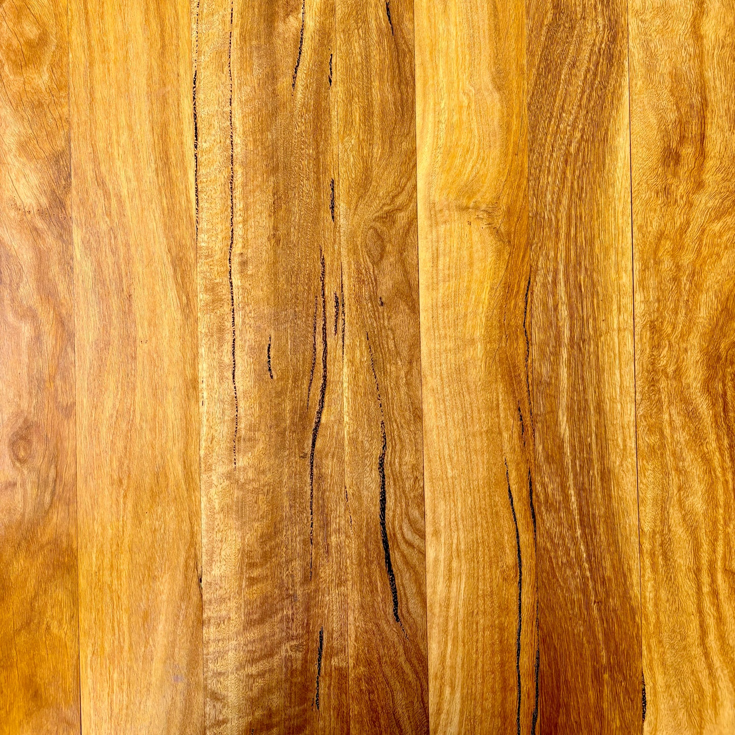 Close-up of a wooden surface with visible grain and texture