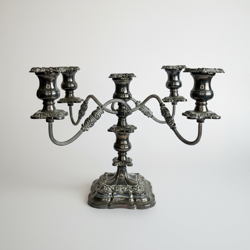 Decorative silver candelabrum on a white background