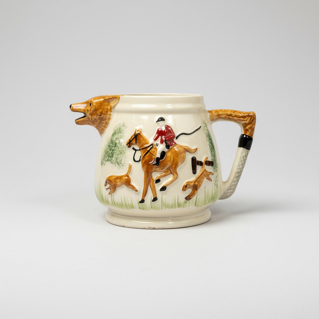 Decorative ceramic pitcher with hunting scene on a white background