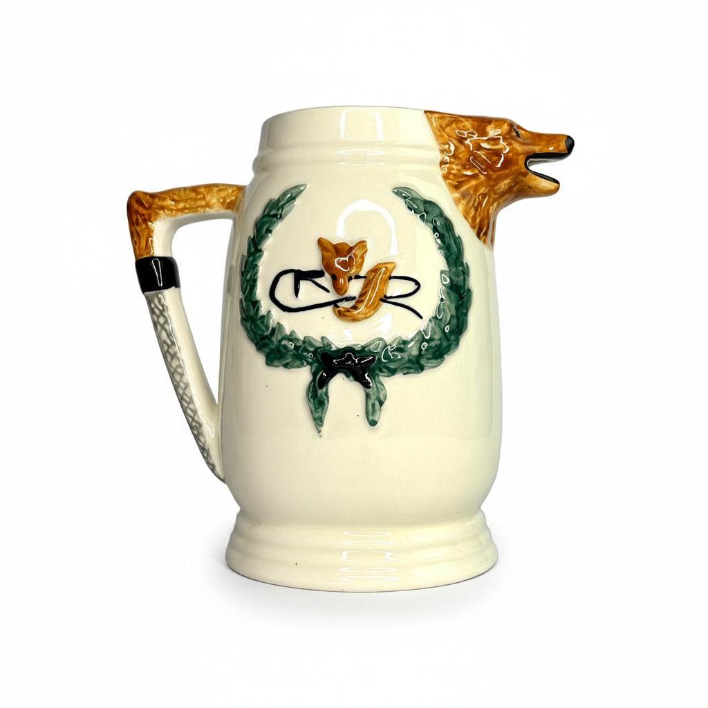 Decorative ceramic mug with a handle shaped like a bear and a design on a white background