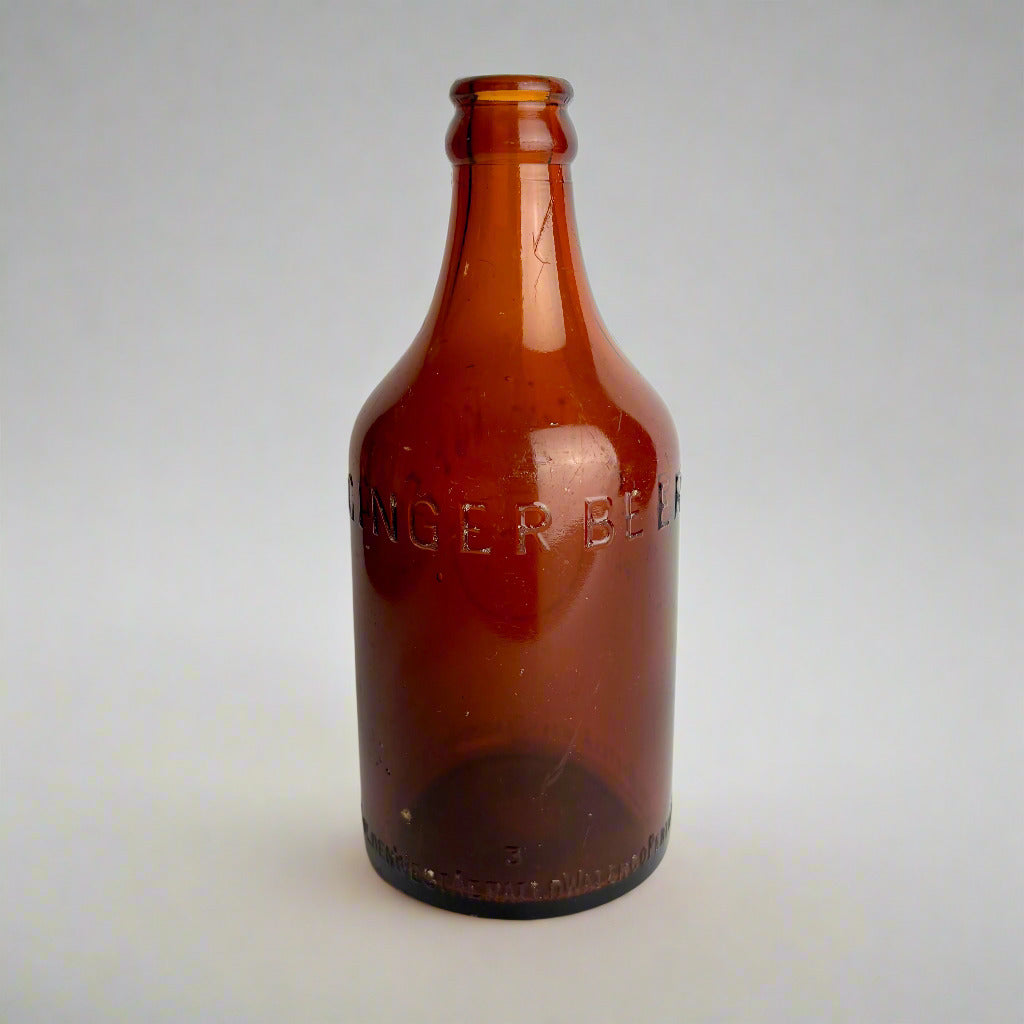 Brown bottle with 'Binger Beer' embossed on a white background