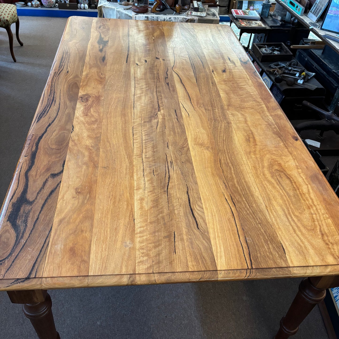 Wooden table with a visible grain pattern in an indoor setting
