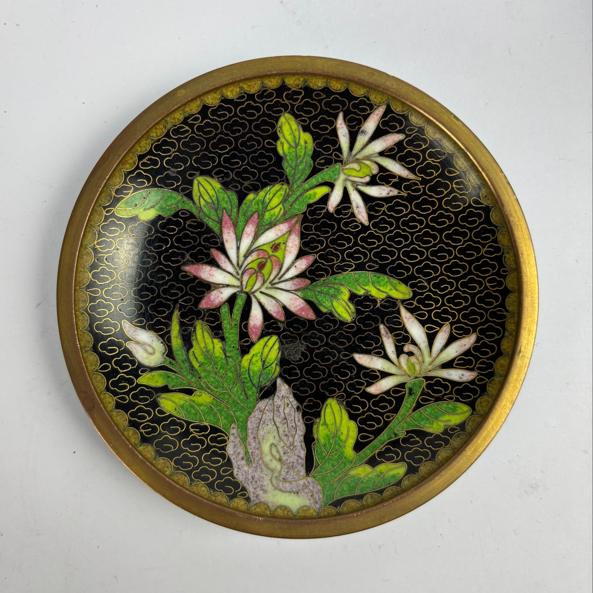 Floral cloisonné enamel dish with black ground and brass rim