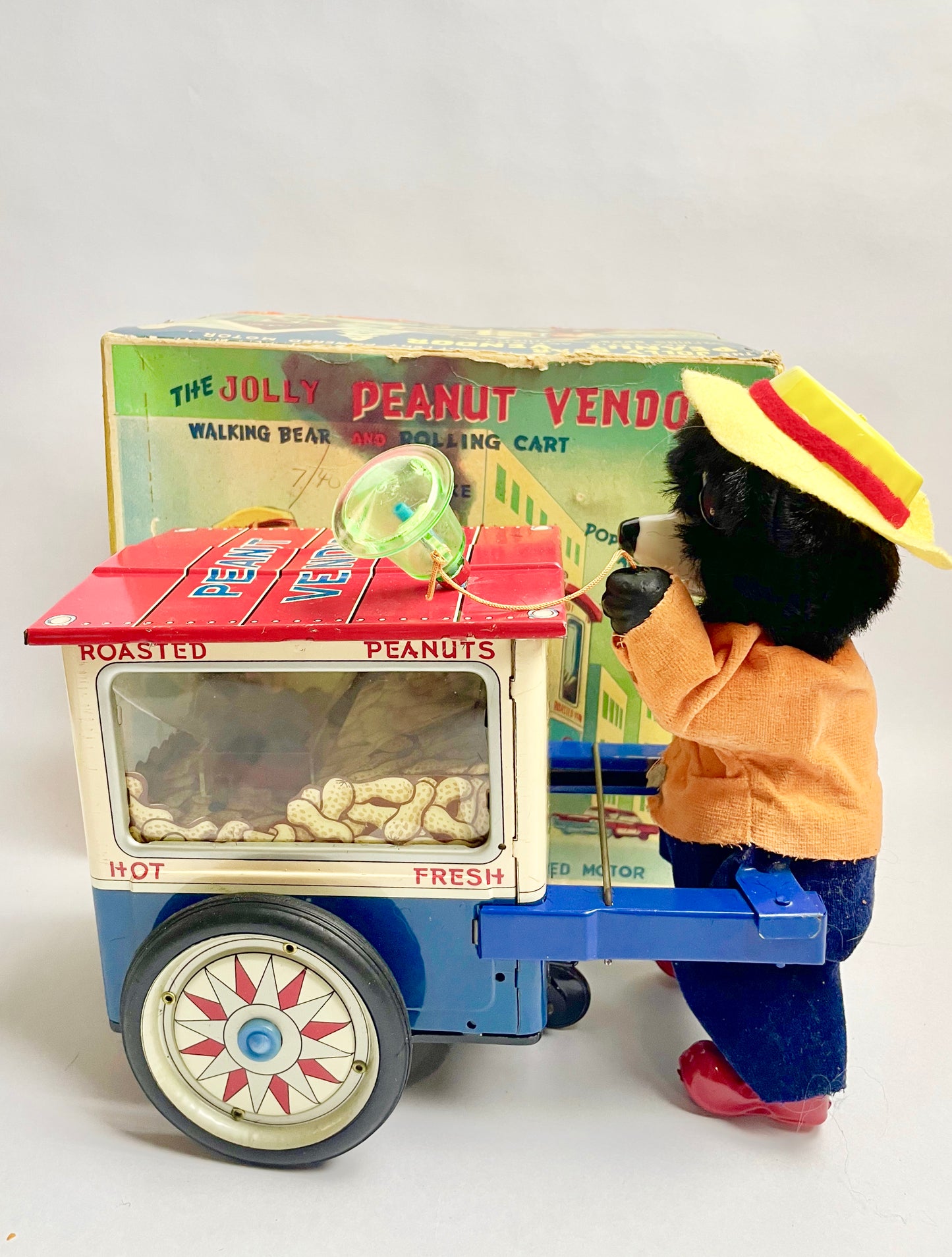 The Jolly Peanut Vendor Walking bear & Rolling Cart