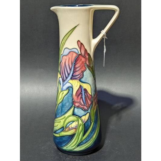 MOORCROFT POTTERY, Tall ewer jug in the 'Iris' pattern, signed M.C.C.