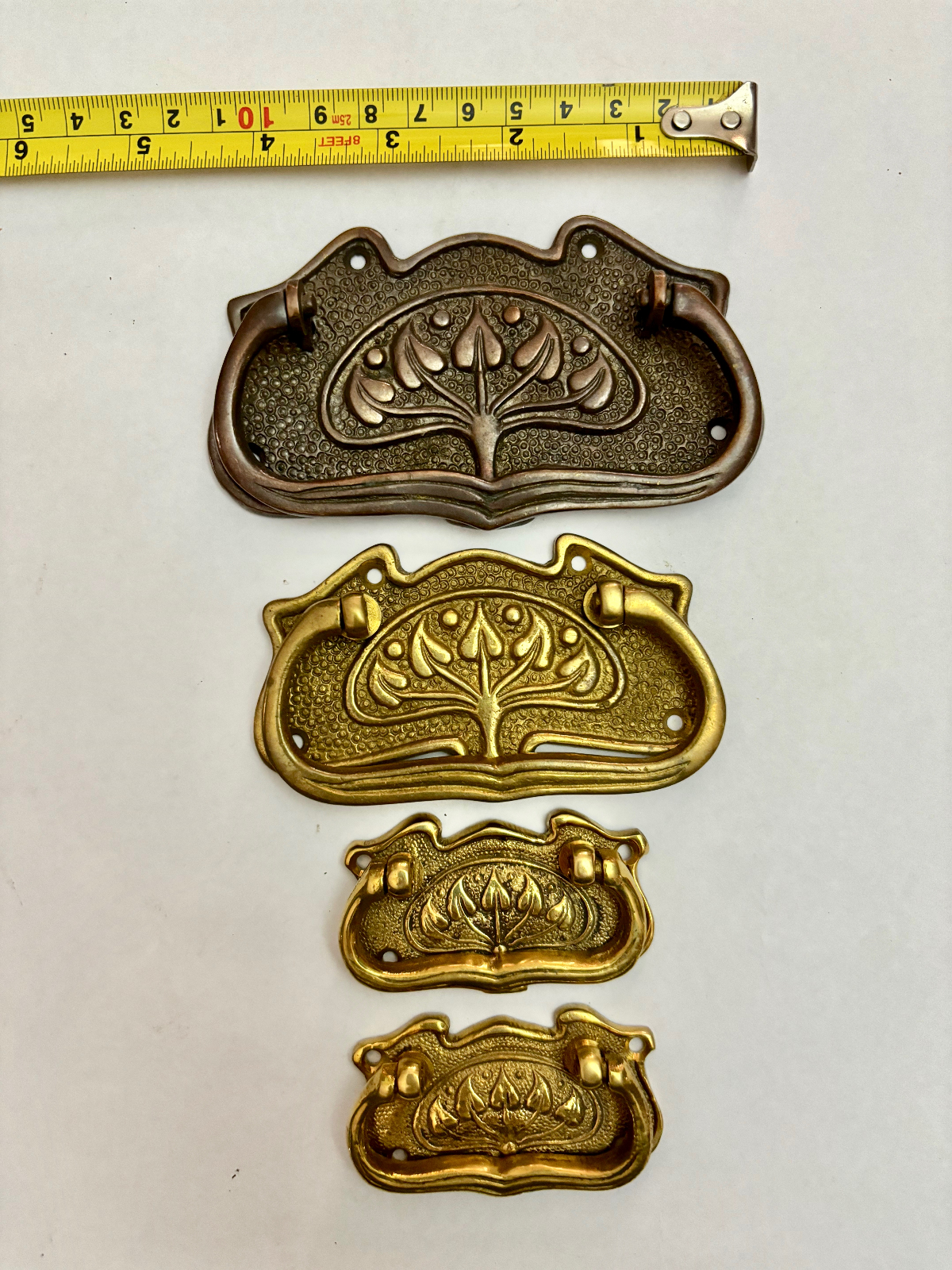 Four Large Mixed Antique Brass Drawer Pull Handles