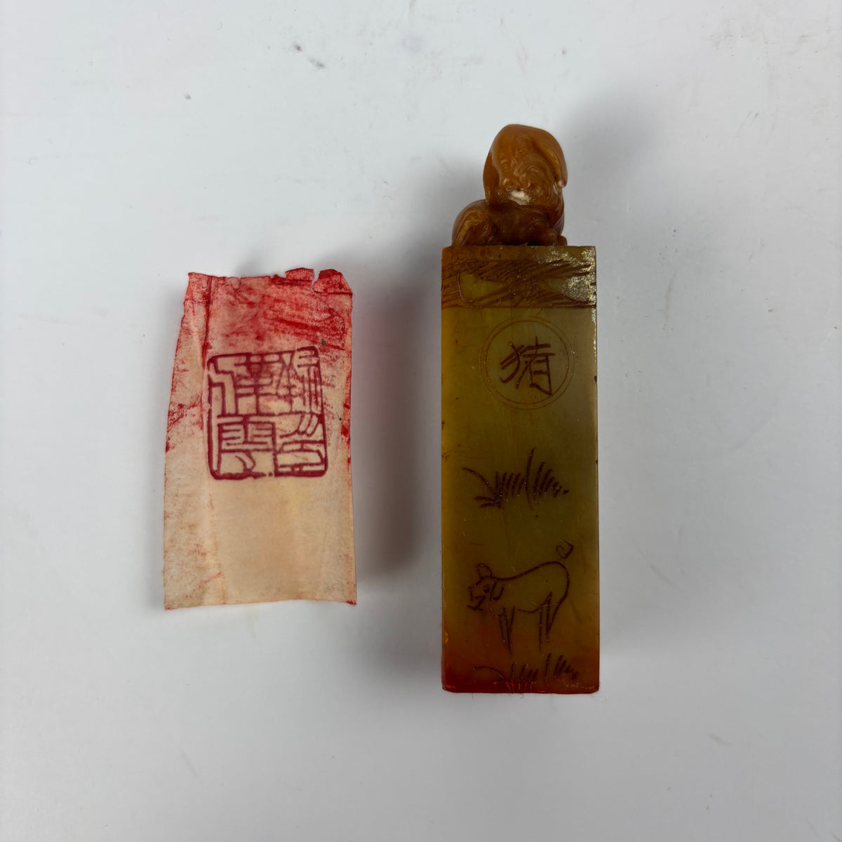 Chinese stone seal with animal finial and red ink impression