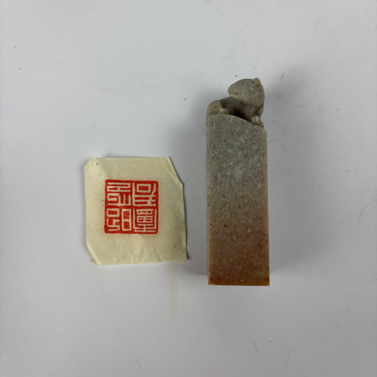 Chinese stone seal and red ink impression