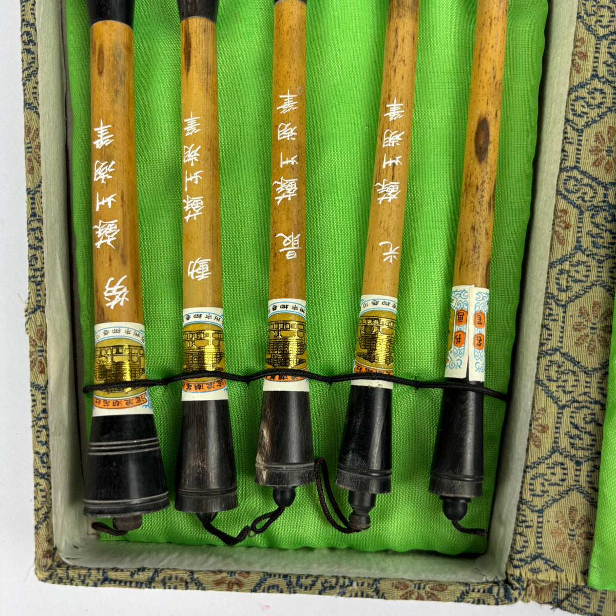Five Chinese calligraphy brushes in green brocade case, view 4