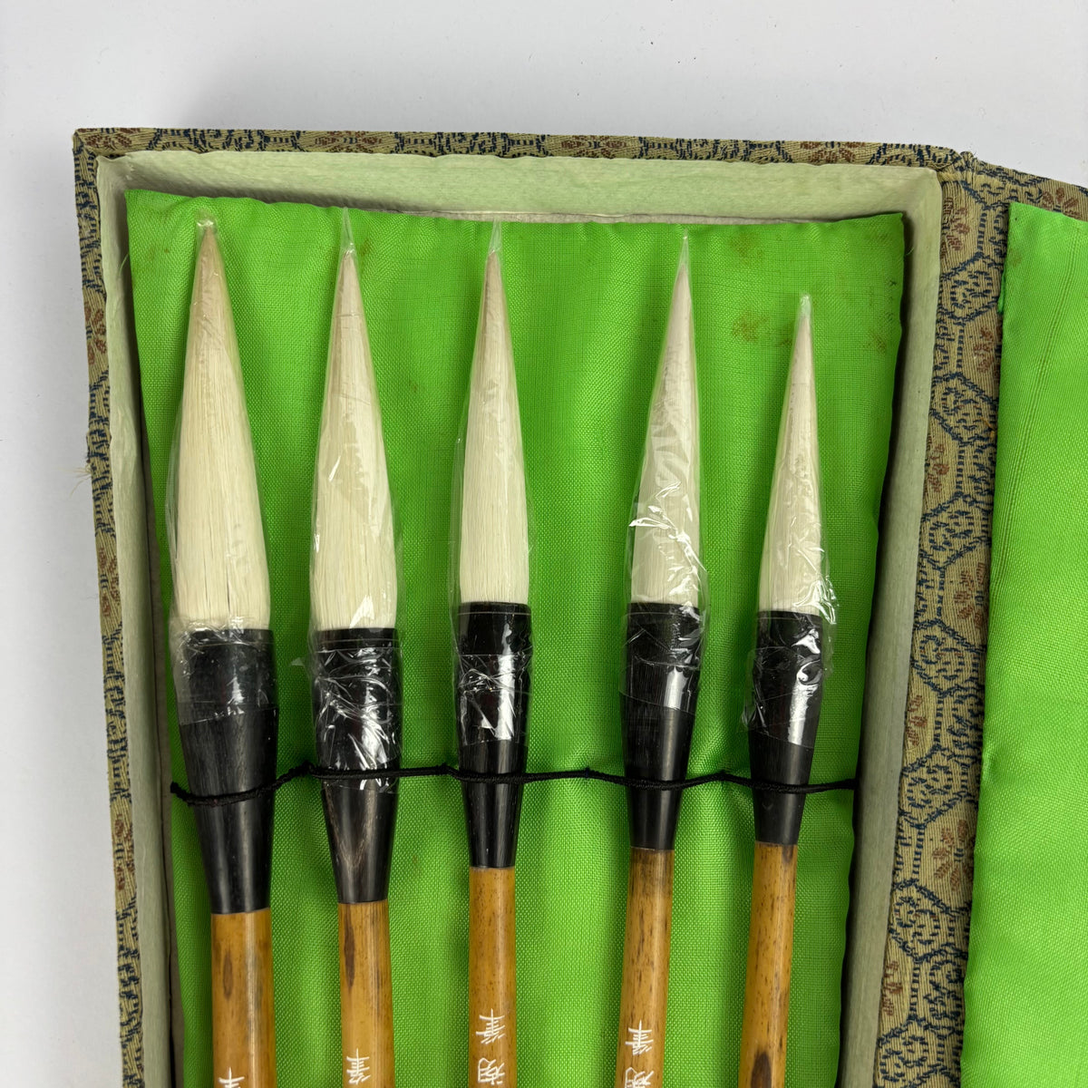 Five Chinese calligraphy brushes in green brocade case, view 3