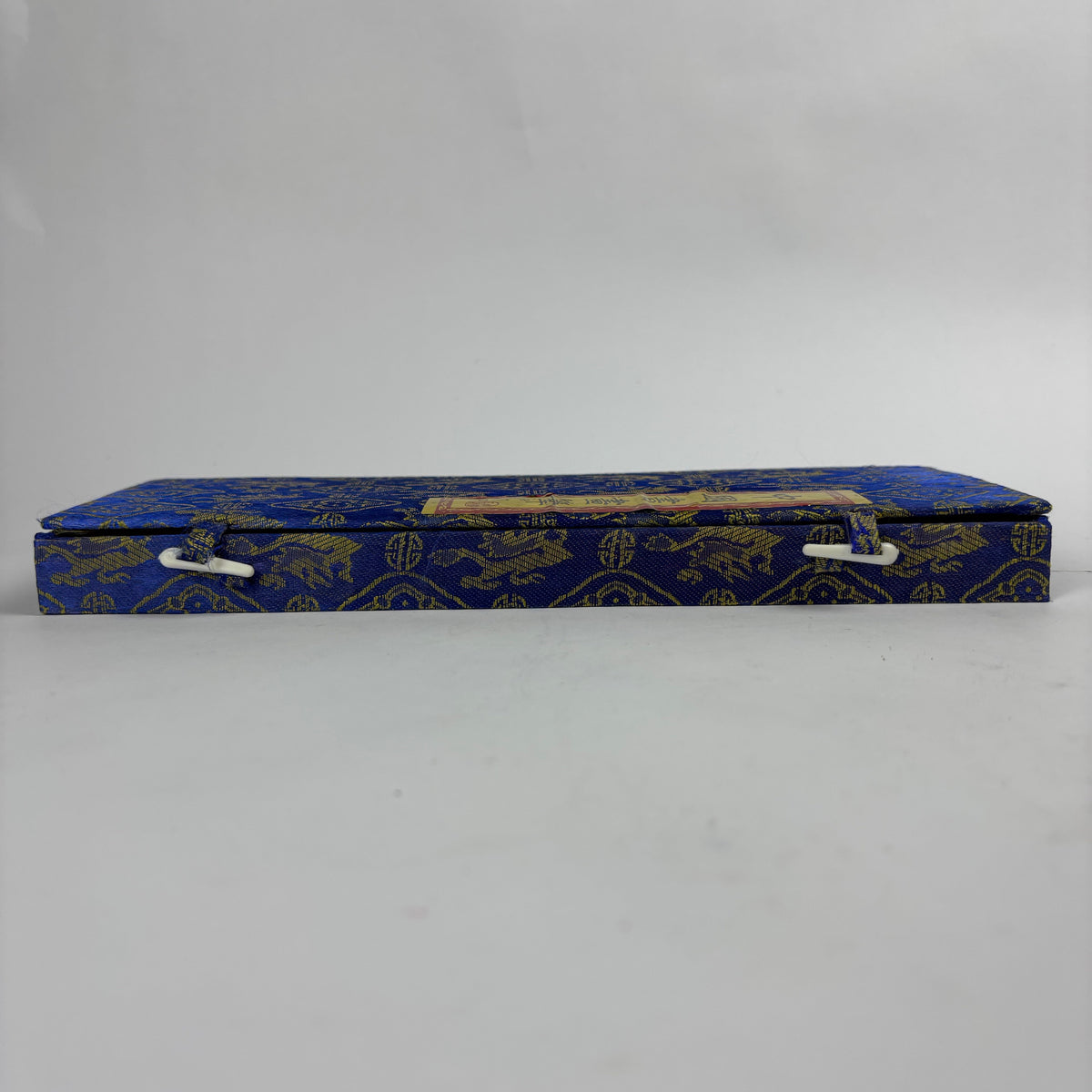 Seven Chinese calligraphy brushes in blue gold brocade case view 5