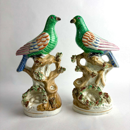 Pair of Antique Staffordshire pottery figurines of exotic pigeons with nests