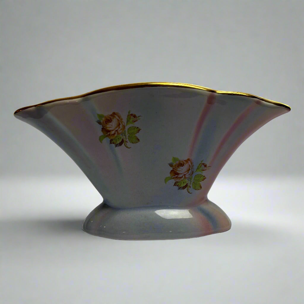 Decorative ceramic bowl with floral patterns on a white background