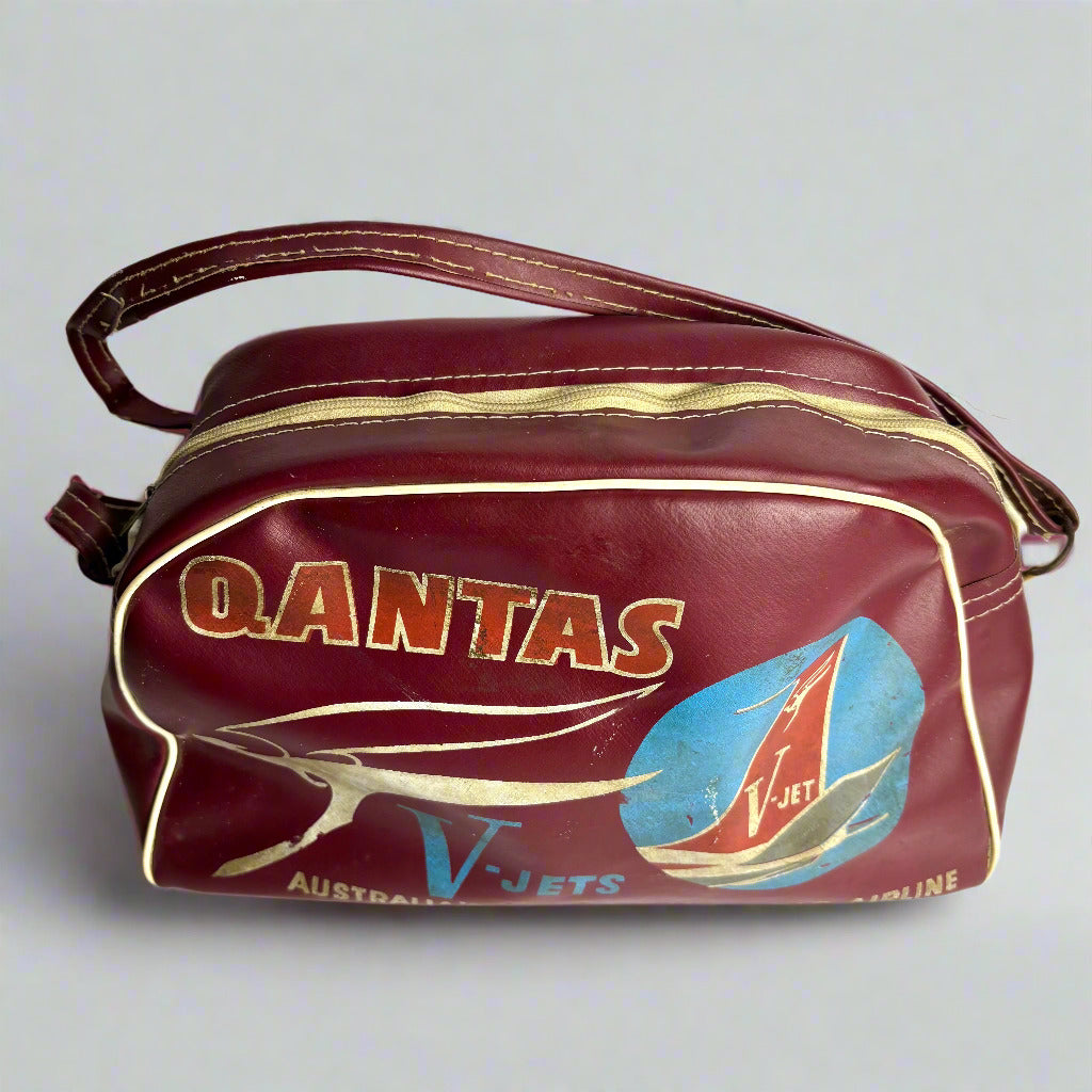 Vintage Qantas travel bag with branding on a white background