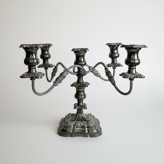 Decorative silver candelabrum on a white background