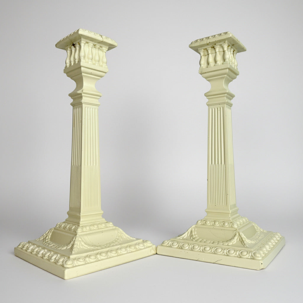 Two decorative columns on a gray background
