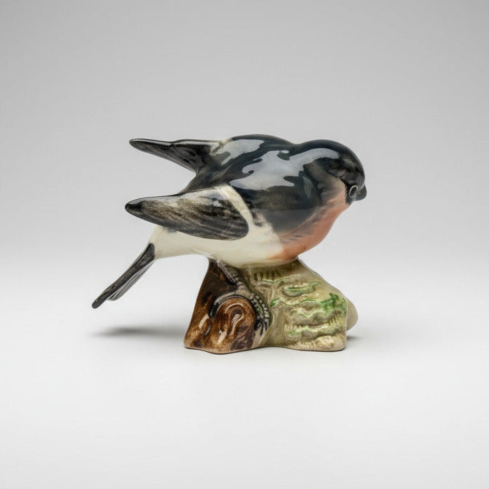 Porcelain bird figurine on a white background