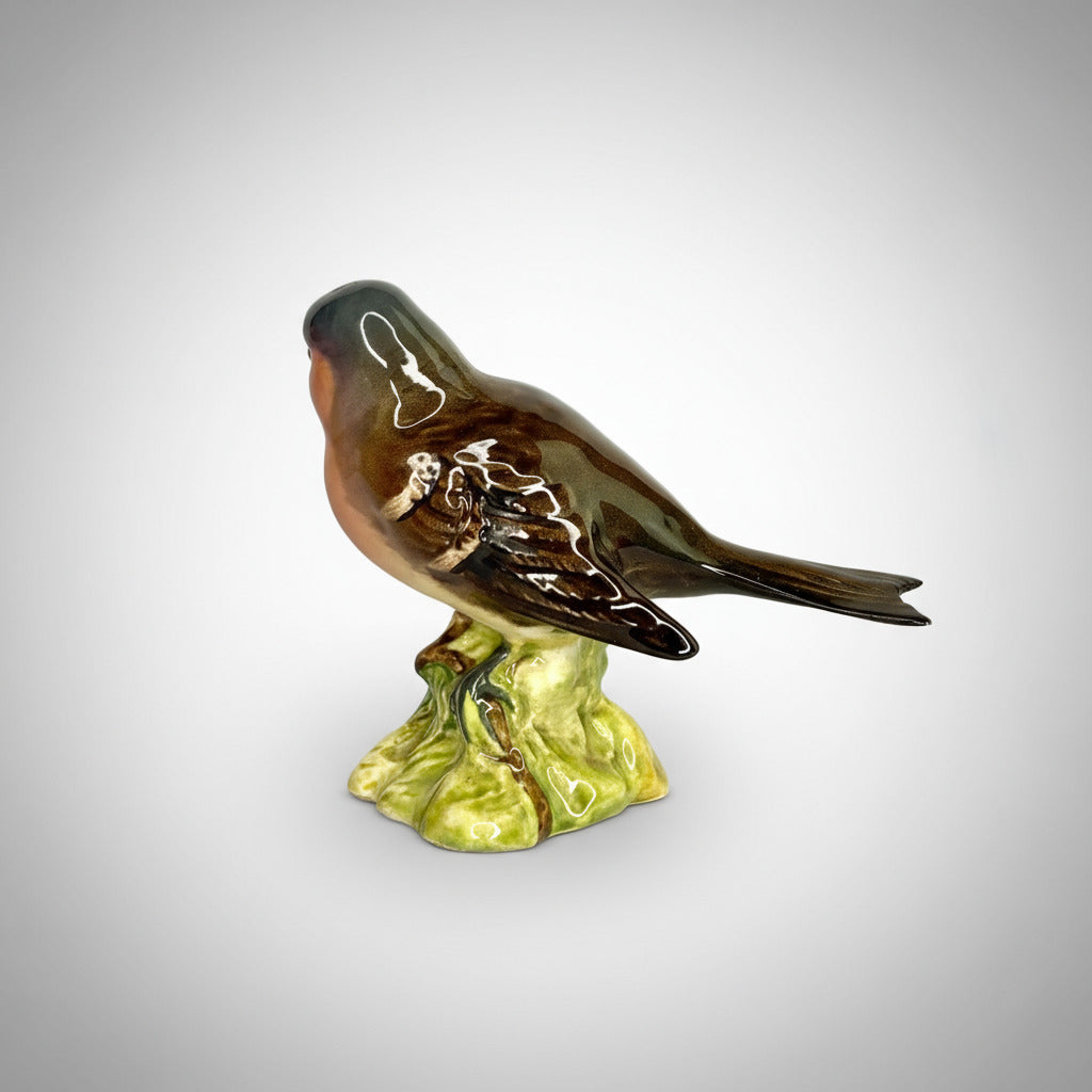 Porcelain bird figurine on a white background