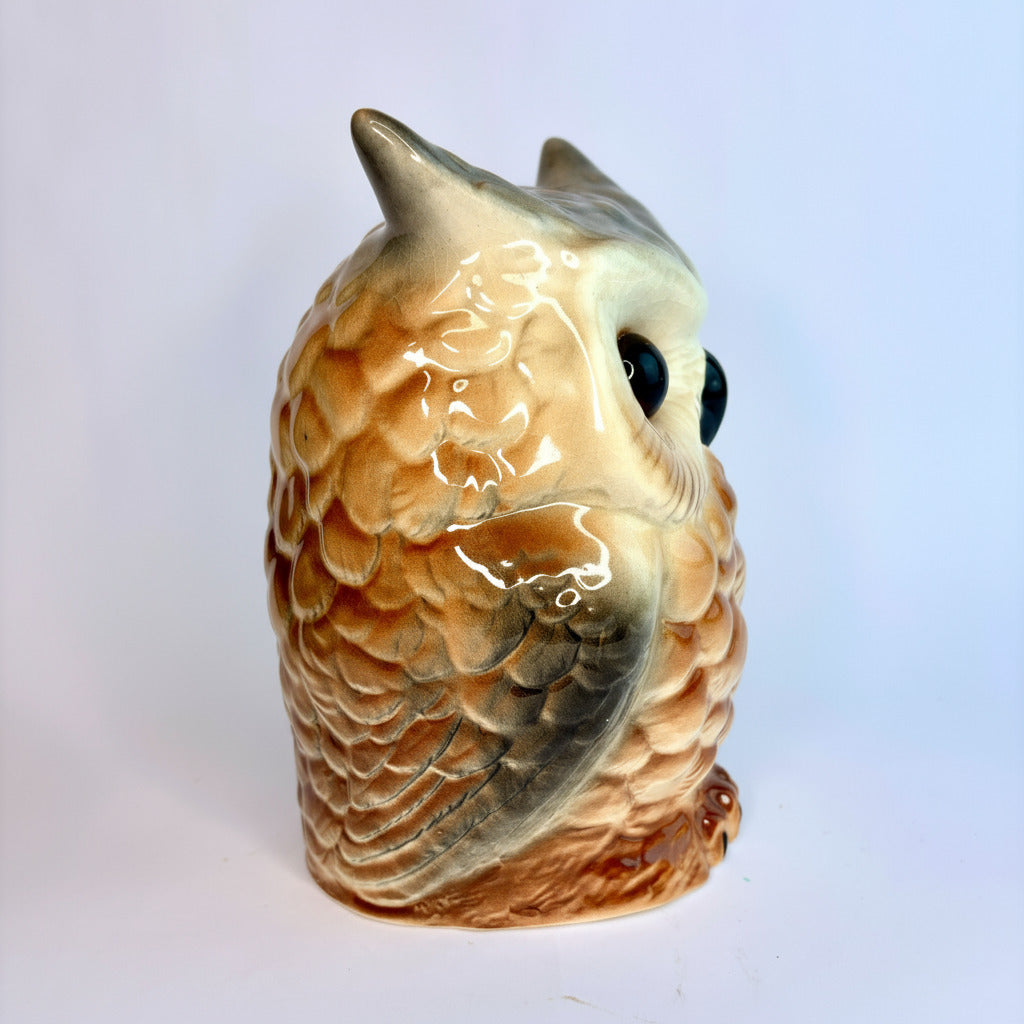 Ceramic owl head on a white background