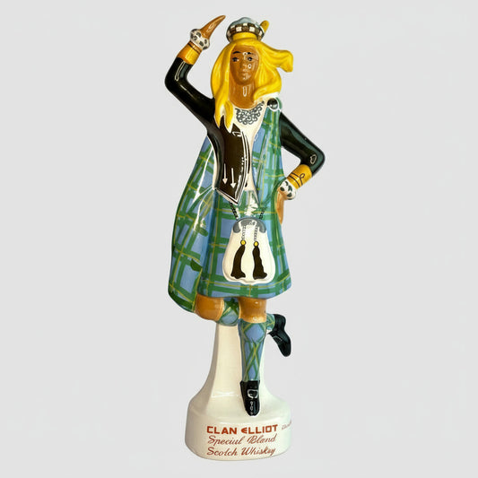 Statue of a woman in traditional Scottish dress on a Clan Elliot whiskey bottle.