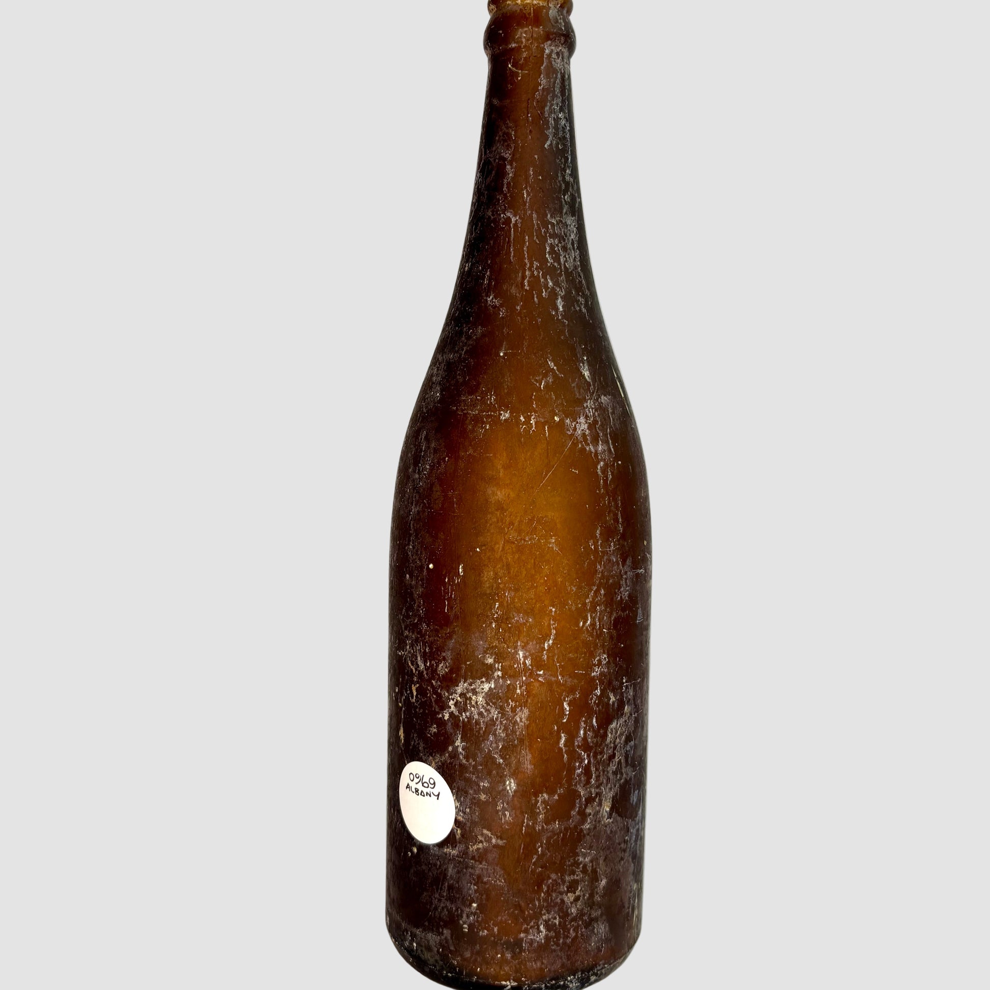Brown bottle with a label on a white background