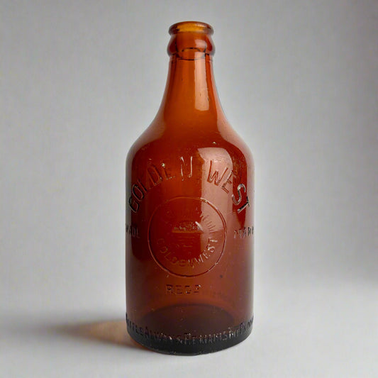 Brown bottle with 'Old West' branding on a white background
