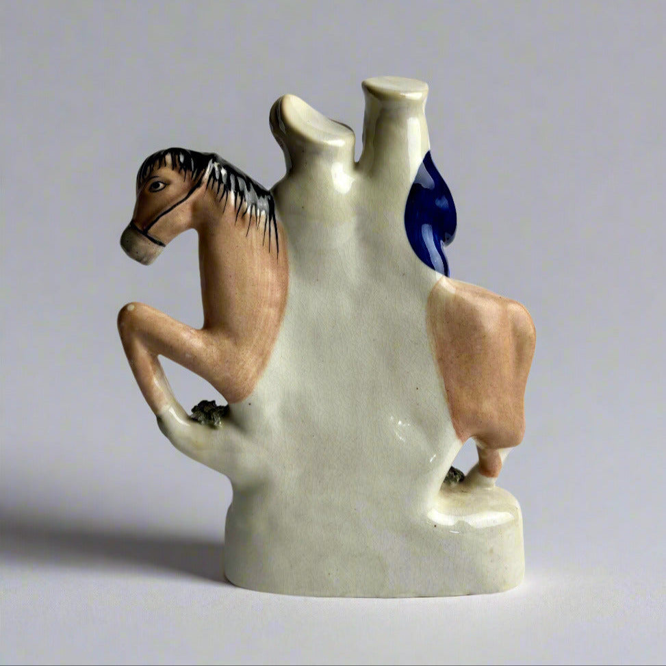 Ceramic vase with horse design on a plain background