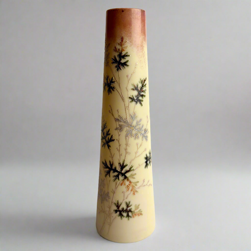 Decorative vase with floral patterns on a plain background