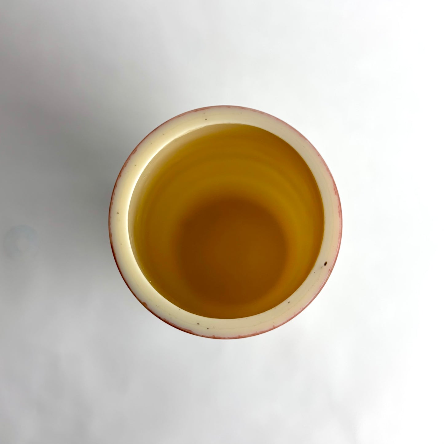 Ceramic pot with a textured surface on a white background