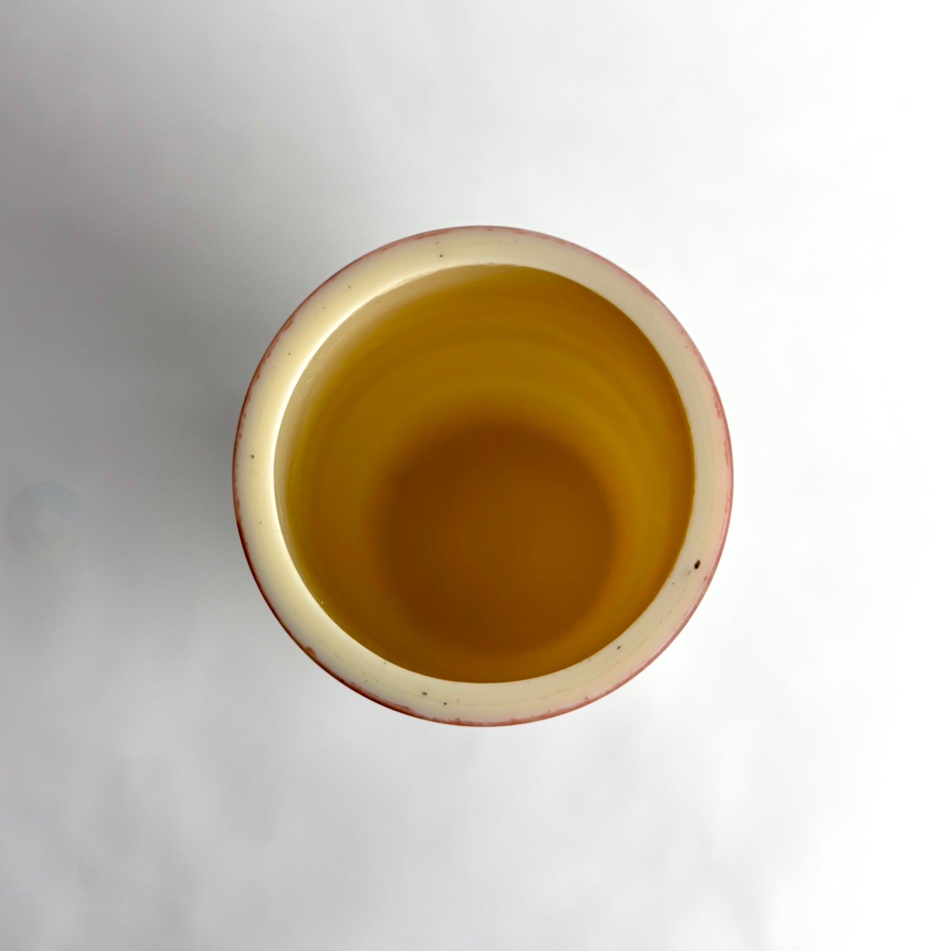 Ceramic pot with a textured surface on a white background