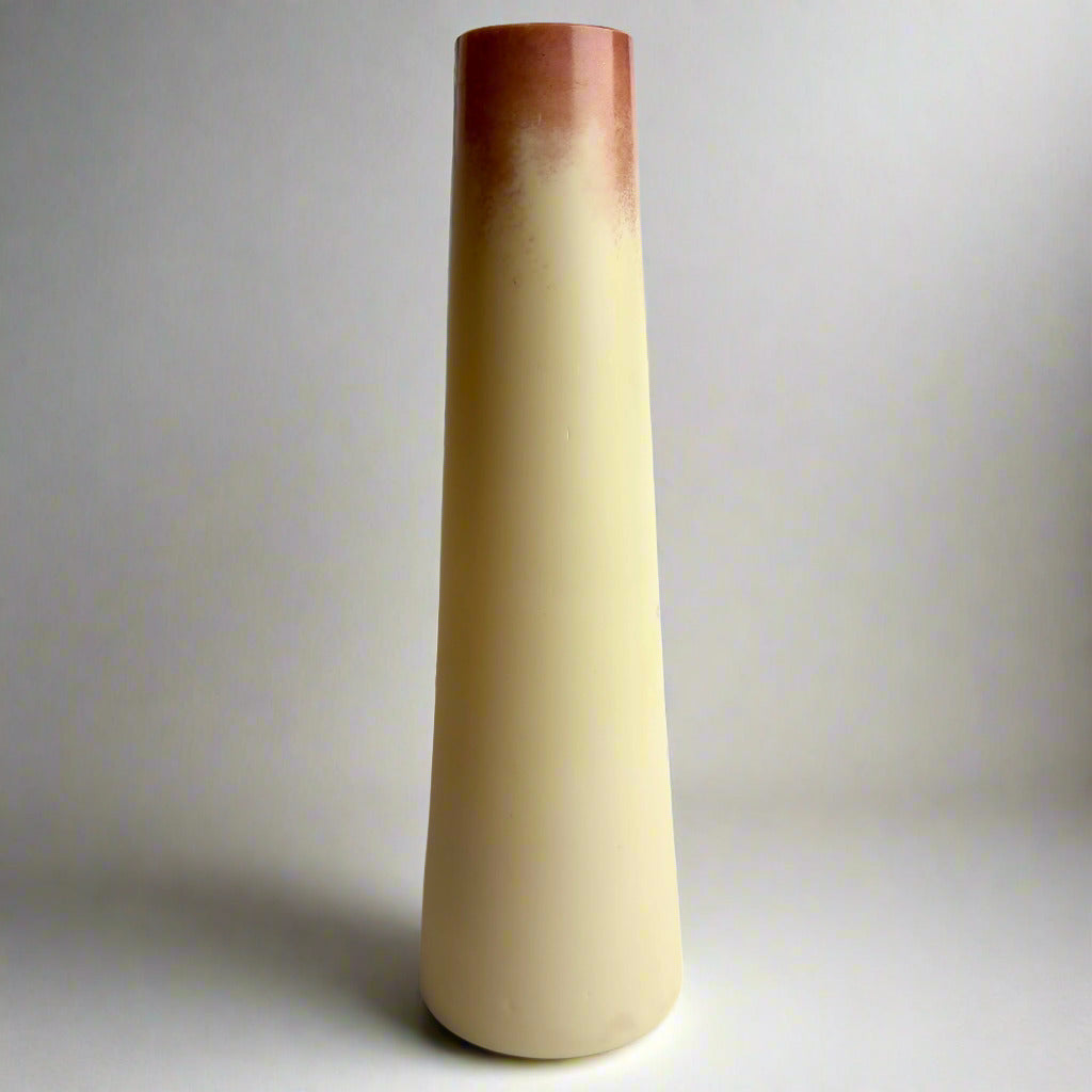 Tapered ceramic vase with gradient color from brown to beige on a white background
