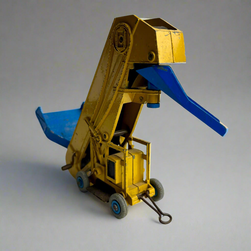 Toy bulldozer with blue blade on a white background
