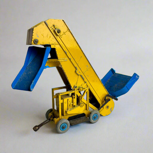 Toy dump truck with blue bed on a white background