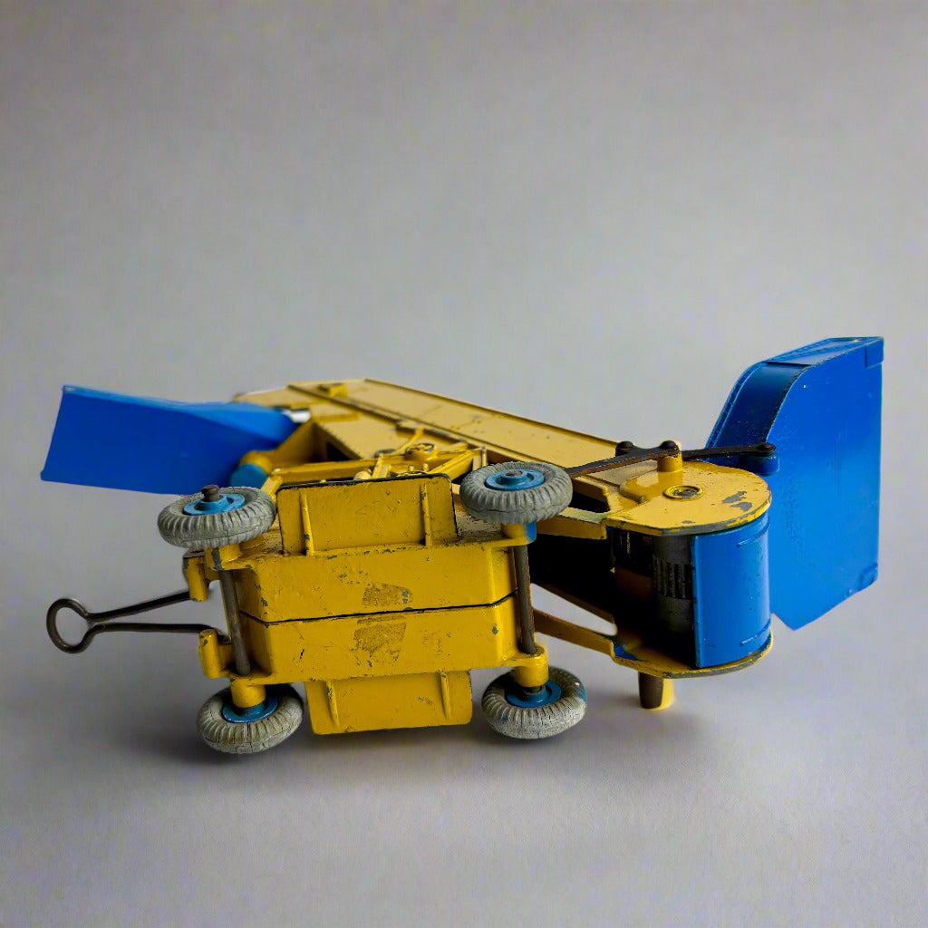 Toy vehicle with blue wings and yellow body on a white background