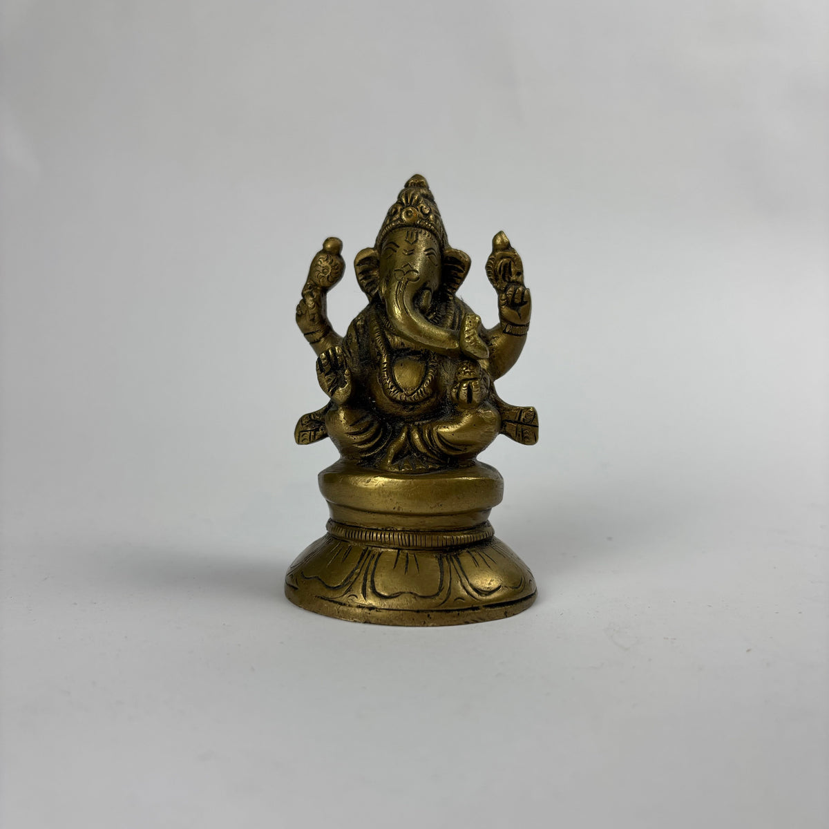 Small brass Ganesha figurine view 1