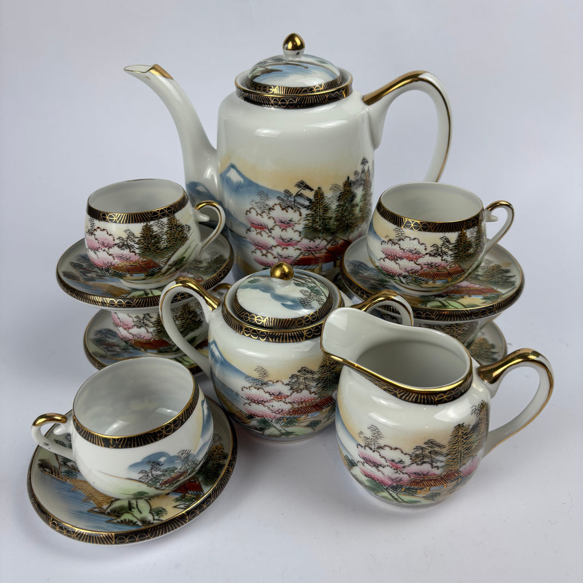 Japanese landscape gilt porcelain tea service view 1