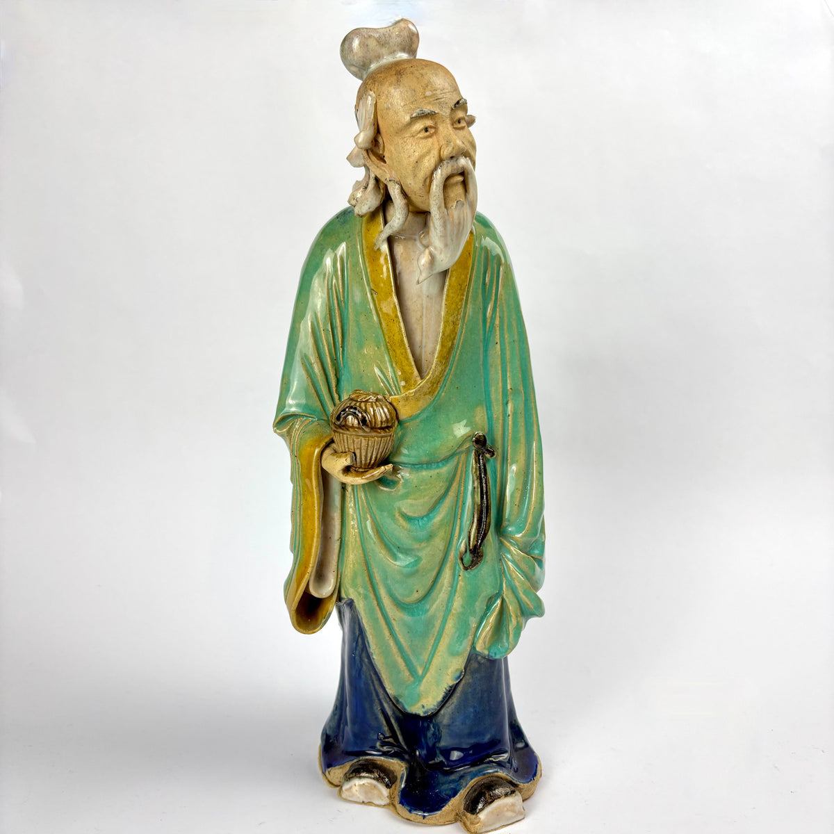 Front view glazed scholar figurine