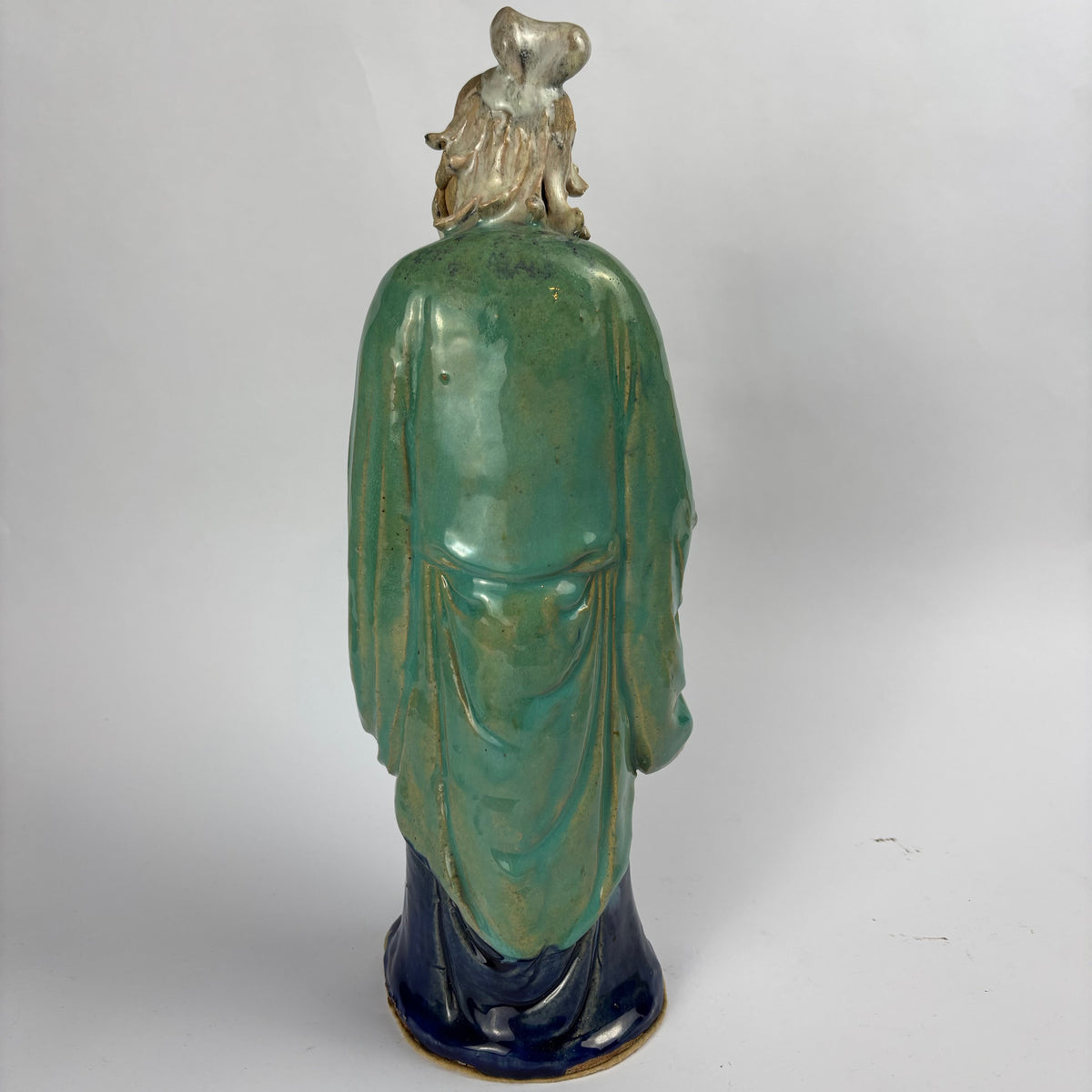 Rear view turquoise glazed robes