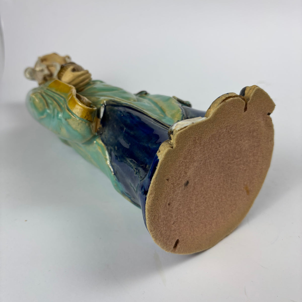 Underside of ceramic figurine