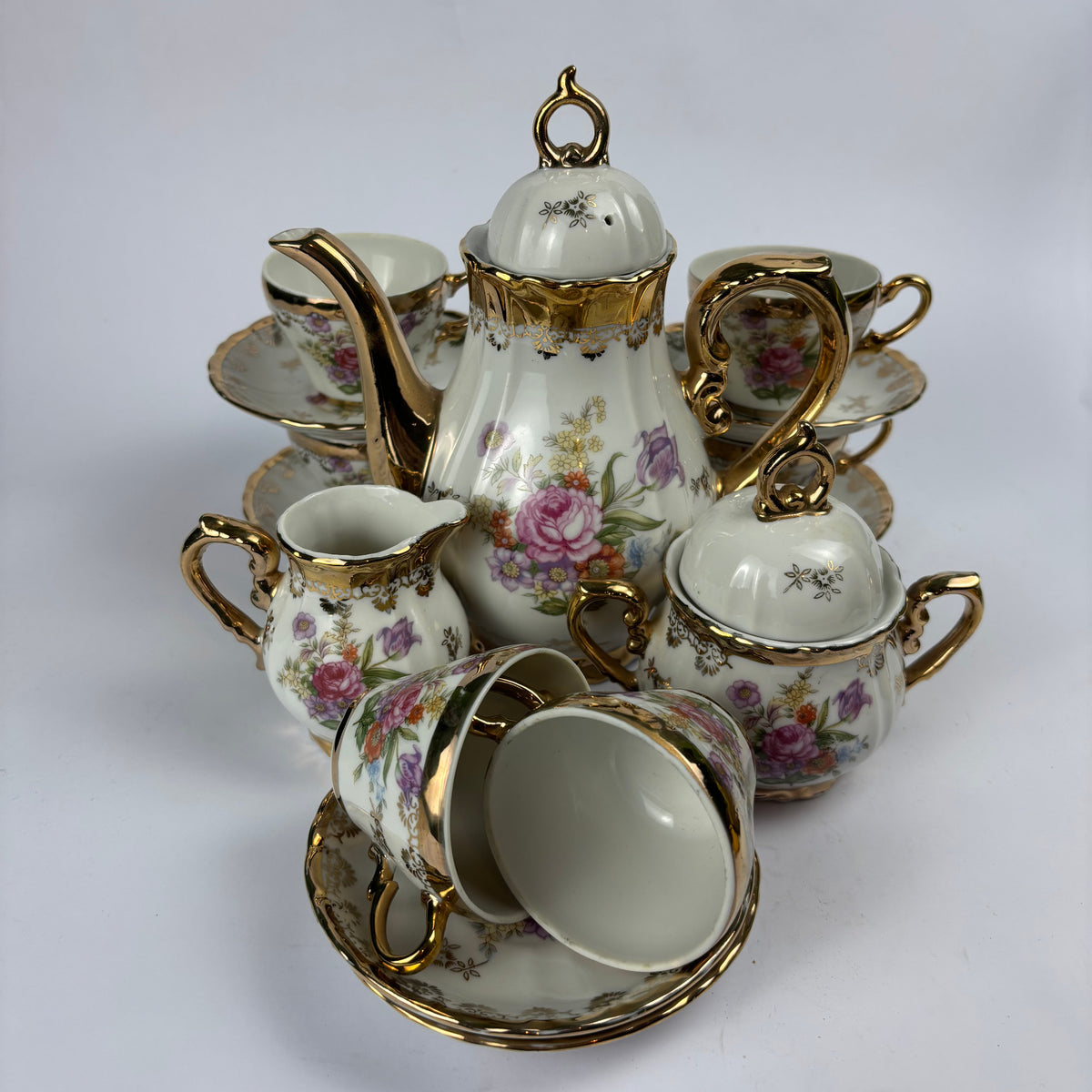 Floral gilt porcelain miniature tea and coffee service view 1