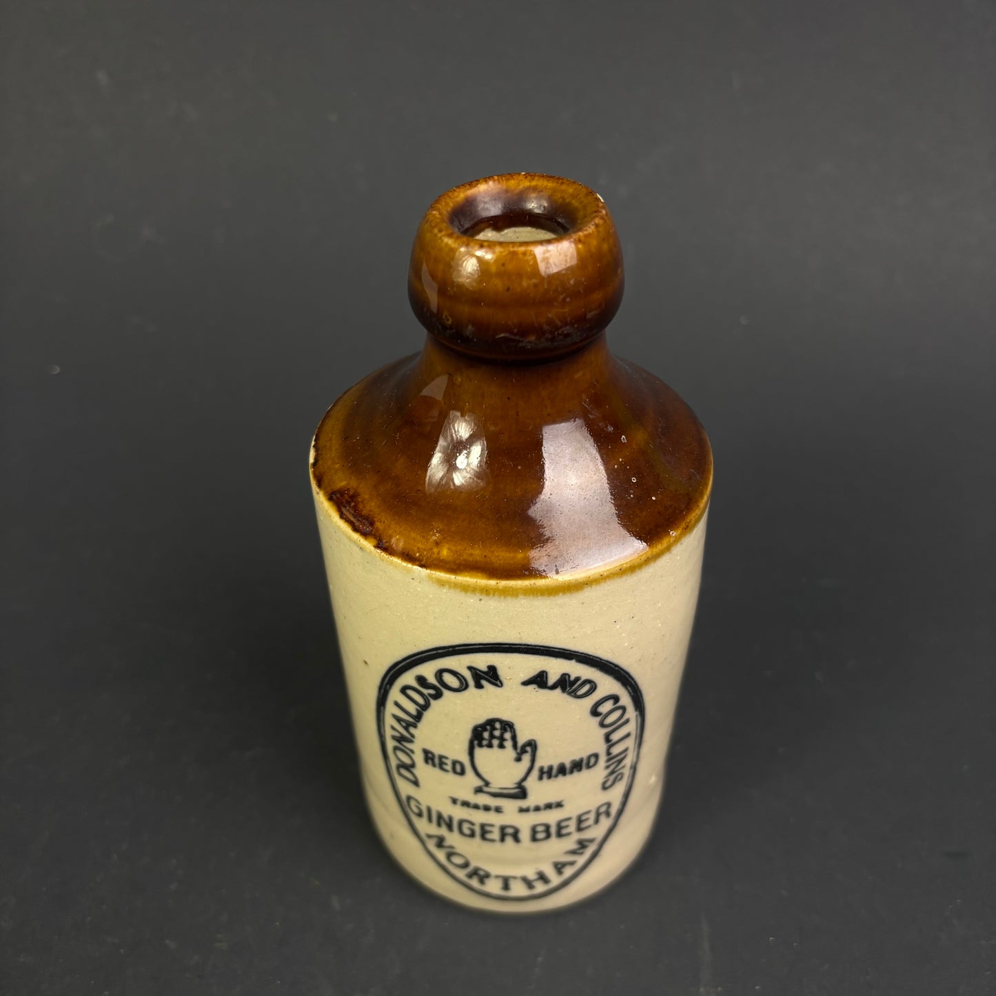 Donaldson & Collins "Red Hand" Ginger Beer Bottle – Northam WA Stoneware Advertising Bottle c.1900–1915